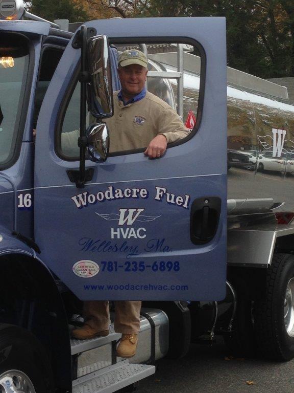 Doug Woodacre standing next to the Woodacre HVAC truck